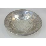 A Continental white metal circular bowl with embossed floral decoration, 5.5oz, 22cm