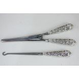 A pair of Edward VII silver mounted glove stretchers and matching button hook, maker Arthur Willmore