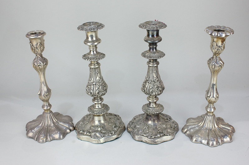 Two pairs of silver plated candlesticks, one pair Art Nouveau style, 26cm high, (a/f - one missing