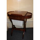 A Regency ebony line inlaid mahogany work, games and reading table with rising rectangular top,