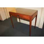 A rectangular mahogany side table with central drawer with brass drop handle, flanked by two