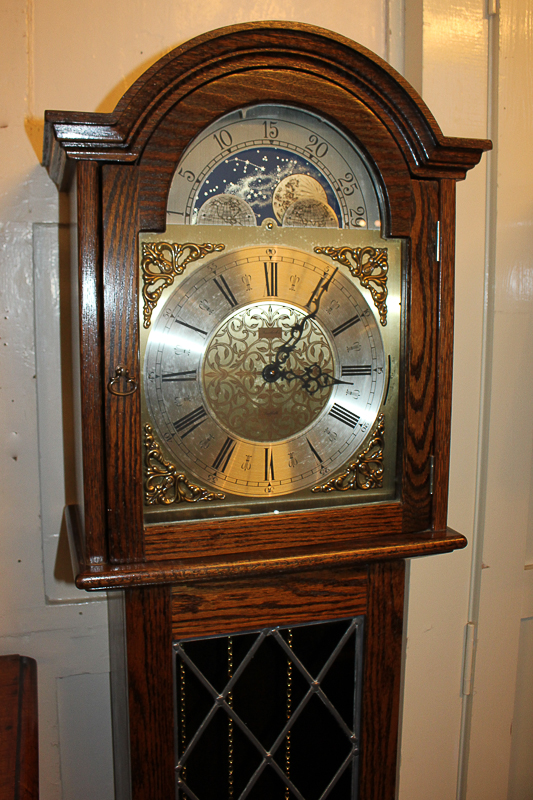 A Fenclocks reproduction chiming long case clock, 11 inch arched dial with moon phases, marked '