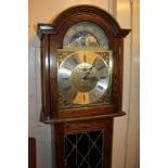 A Fenclocks reproduction chiming long case clock, 11 inch arched dial with moon phases, marked '