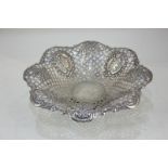 A Victorian silver pedestal bowl of scalloped form, pierced design and scroll border, maker James