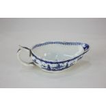 An 18th/early 19th century blue and white sauce boat, probably Worcester, decorated with Chinese