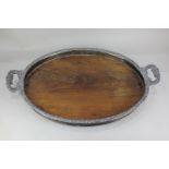 A Victorian silver plate mounted oval rosewood tea tray with two handles (a/f), 64cm long