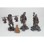 Three oriental carved wooden figures of fishermen (one with damage but piece present), 14cm, and a