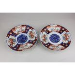 A pair of 20th century Imari porcelain plates, each decorated with scalloped rim and central