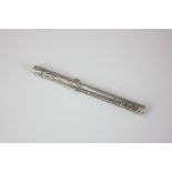 An S Mordan Victorian silver combined propelling pencil and dipper with sliding button action,