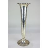 A Tiffany and Co sterling silver vase, tapered form with flared rim, engraved with scrolls and