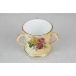 A Royal Worcester porcelain miniature tyg, with hand painted floral motifs on blush ivory ground,