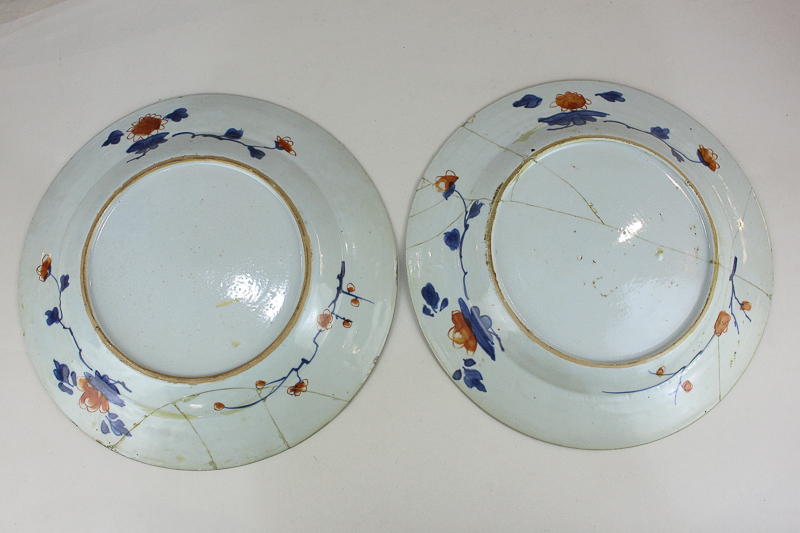 A pair of Japanese Imari porcelain plates decorated with central panel depicting a bowl of - Image 2 of 3