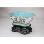 A Chinese porcelain bowl of shaped rectangular form, decorated with warriors and other figures,