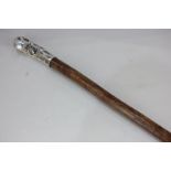 A Victorian Scottish silver mounted hardwood walking stick, the silver with nobbled wood effect,