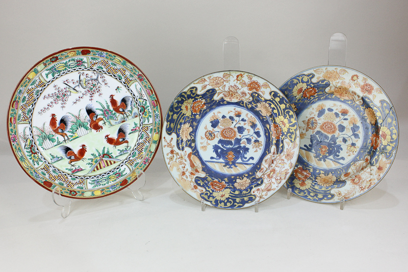 A pair of Japanese Imari porcelain plates decorated with central panel depicting a bowl of