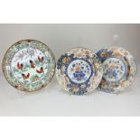 A pair of Japanese Imari porcelain plates decorated with central panel depicting a bowl of