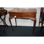 A mahogany bow front card table with fold-over baize lined top, two drawers, on cabriole legs, 77cm