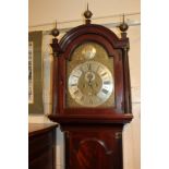 A George III mahogany longcase clock with 12 inch arched brass dial, with seconds dial and