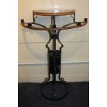 A Hayes & Finch wrought iron and oak framed votive stand, the top with five candle holders, metal