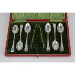 A cased set of six Edward VII silver coffee spoons with tongs, maker Joseph Ridge, Sheffield 1903,