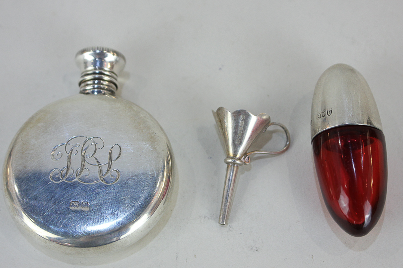 A Victorian silver mounted ruby glass scent bottle by Sampson & Mordan, London 1883, a circular