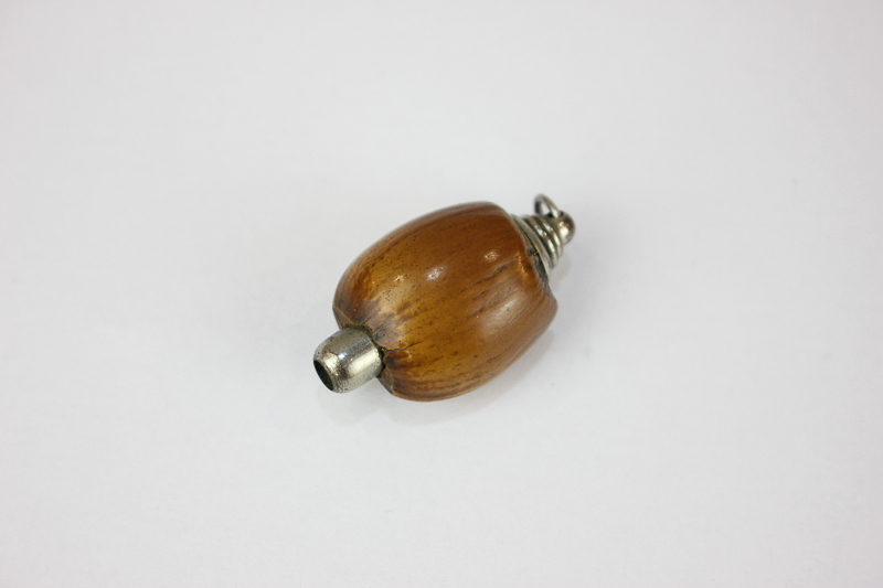 A novelty propelling pencil in the form of a hazelnut, with twist action and ring terminal, 3cm