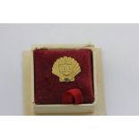 A 9ct gold BP pin badge for long service
