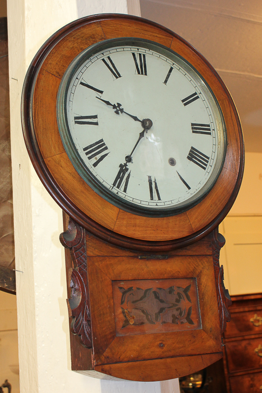 A walnut drop dial wall clock, with 12 inch circular dial and Roman numerals, height 63cm