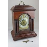 A Victorian mahogany chiming bracket clock with arched brass dial, silvered chapter ring, chime/