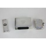 An Elizabeth II silver cigar cutter, a silver vesta case, and a white metal matchbox cover