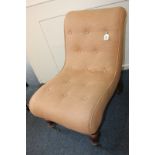 A Victorian button upholstered slipper chair with mahogany frame, on baluster turned front legs