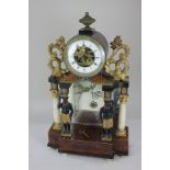 A Venetian gilt wood and metal mounted mantel clock with drum shaped dial containing the figure of a