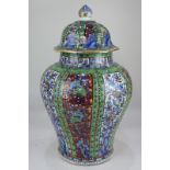 A 19th century Chinese porcelain baluster jar and cover, with floral decoration in blue and white