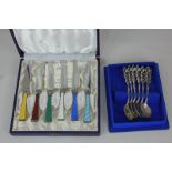 A cased set of six Danish silver and harlequin guilloche enamel dessert knives, the stainless