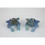 A pair of Daum, Nancy, blue glass frogs with gilded eyes, Daum France etched to base, 6cm high