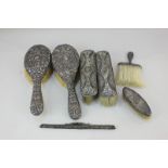 A pair of Victorian silver mounted hair brushes (a/f), a pair of silver mounted clothes brushes, a
