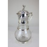 A large silver plate mounted cut glass wine jug, the glass etched with vines and grapes, the mount