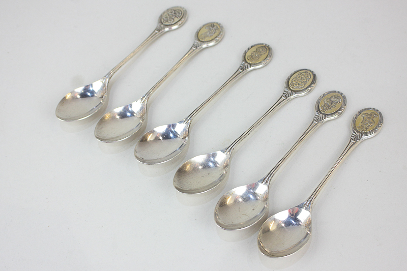 A matched part set of six Elizabeth II silver collector's spoons, maker John Pinches, Sheffield,