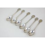 A matched part set of six Elizabeth II silver collector's spoons, maker John Pinches, Sheffield,