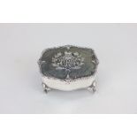 A George V silver and tortoiseshell dressing table box with crested monogrammed lid, maker