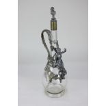 A WMF metal mounted glass decanter and stopper, teardrop form, decorated with a classical figure