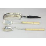 A pair of Victorian silver salad servers with carved ivory handles, maker Atkin Brothers,