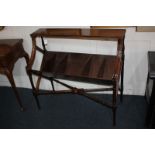 A mahogany book trough with rectangular top, five division rack beneath, on turned legs and X-framed