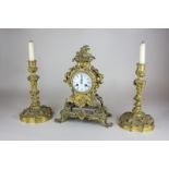 A 19th century French clock garniture, the white and blue enamel dial marked Hodgkins & Co, À Paris,