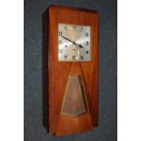 An Art Deco inlaid walnut wall clock with square dial and glazed panel, probably French, 74cm