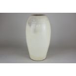 A Chinese Cizhou pottery vase of slender barrel form, with impressed upper and lower band of