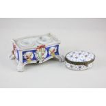 A French porcelain dressing table box of oval form, with floral and gilt decoration, Sevres style