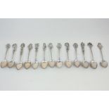 A collection of thirteen Continental white metal coffee spoons, all marked 800 or 835, each with