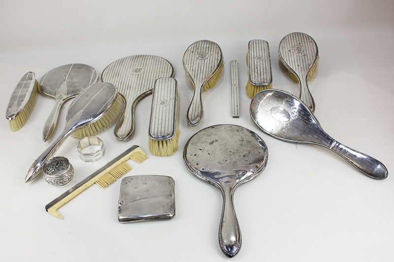 A George VI silver five-piece dressing table set, six other dressing table mirrors and brushes, a