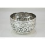 A Victorian silver circular bowl embossed with a central band of astrological symbols, engraved